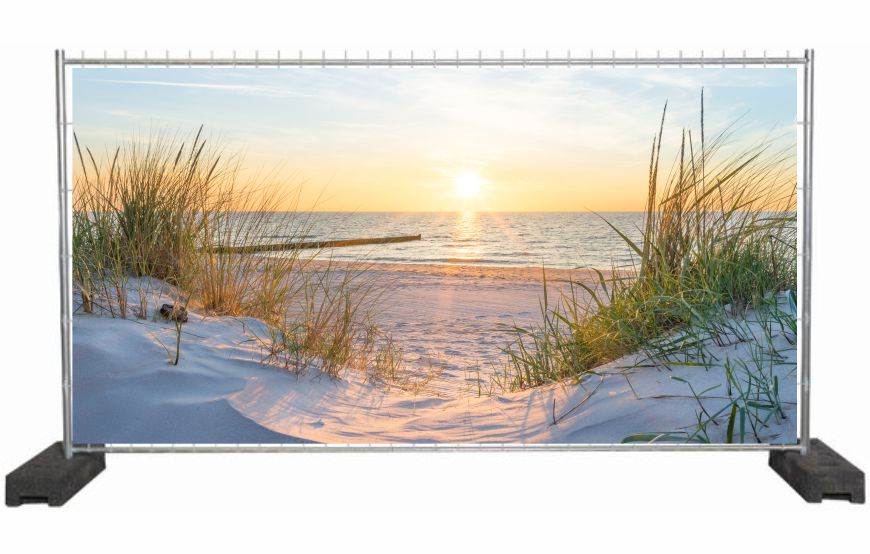 Bauzaunplane mit Naturmotiv Sonnenaufgang am Strand / Sichtschutzbanner